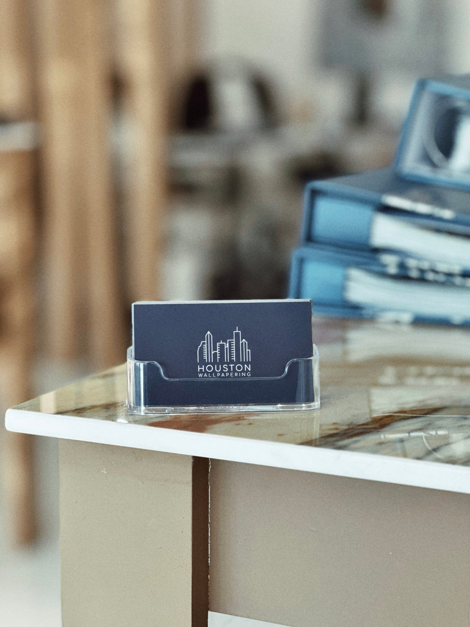 Houston Wallpapering brand card on showroom table