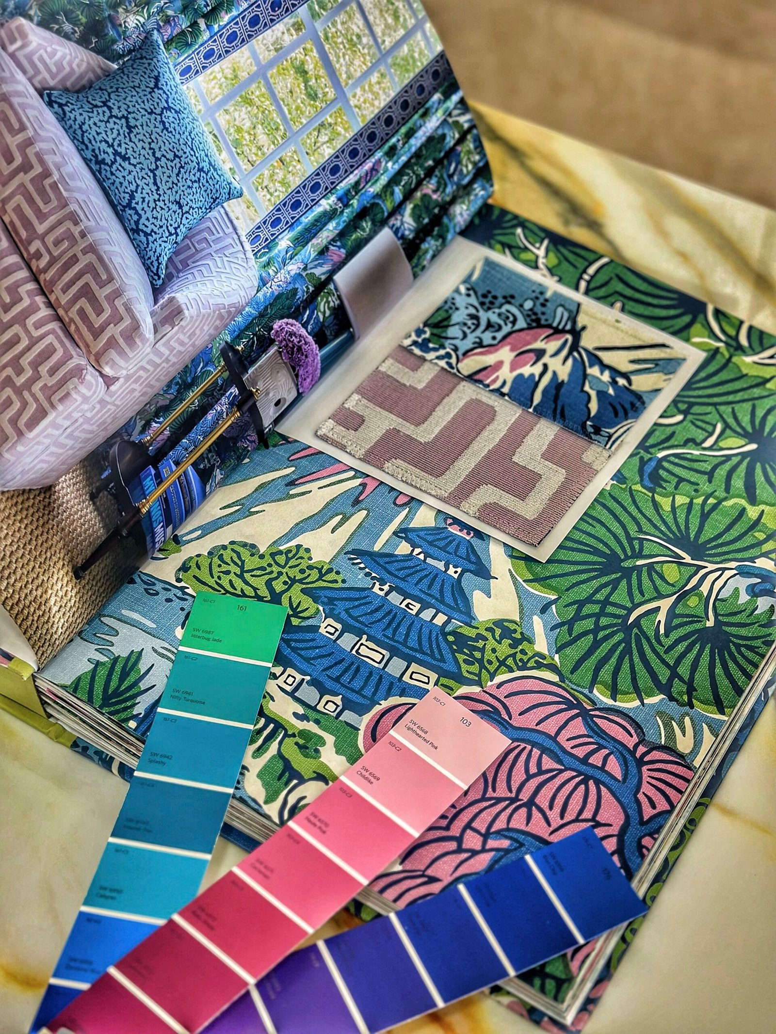 Showroom shelves with curated wallpaper sample books