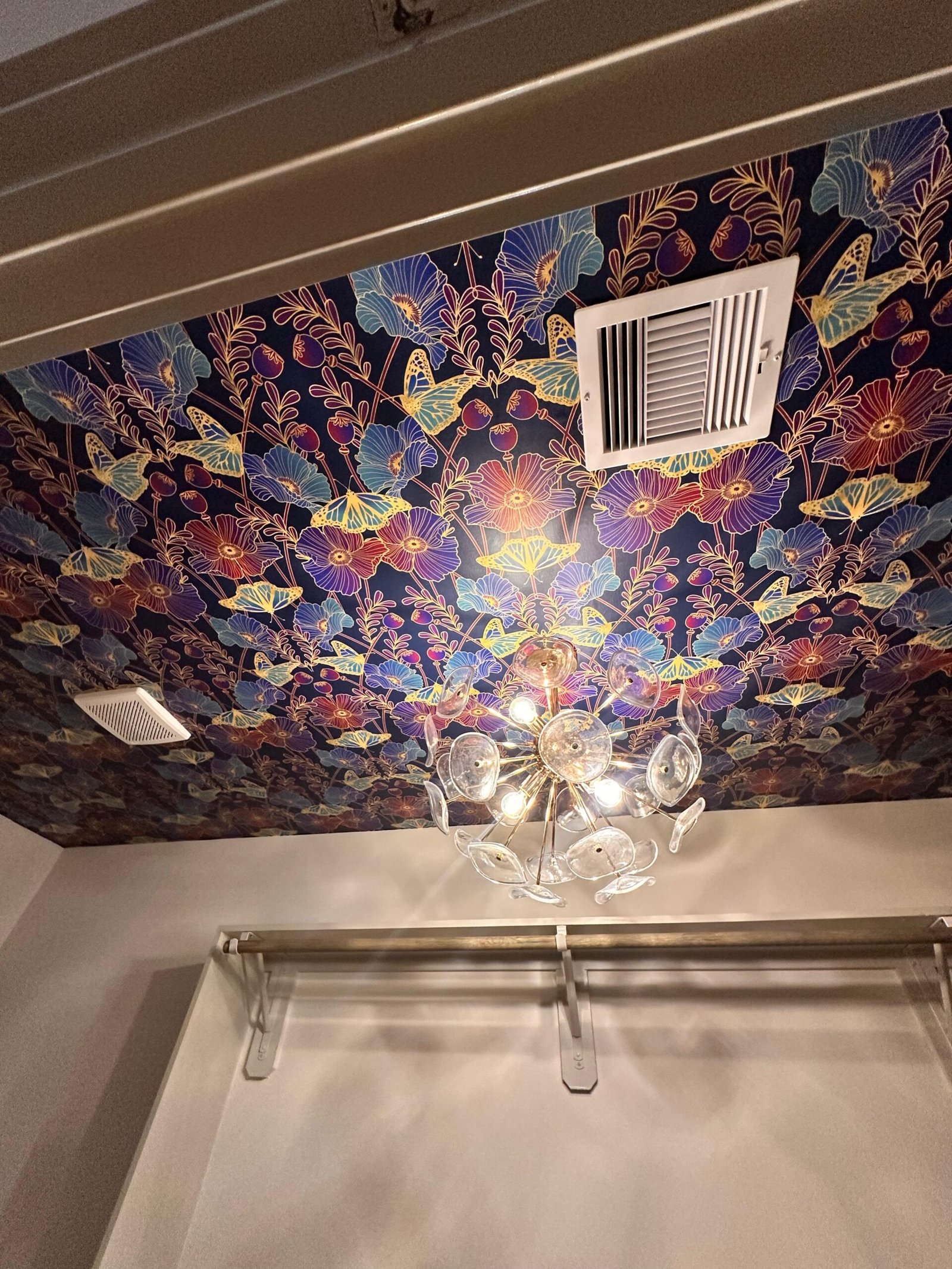 Patterned wallpaper installed on a residential ceiling — Houston home install