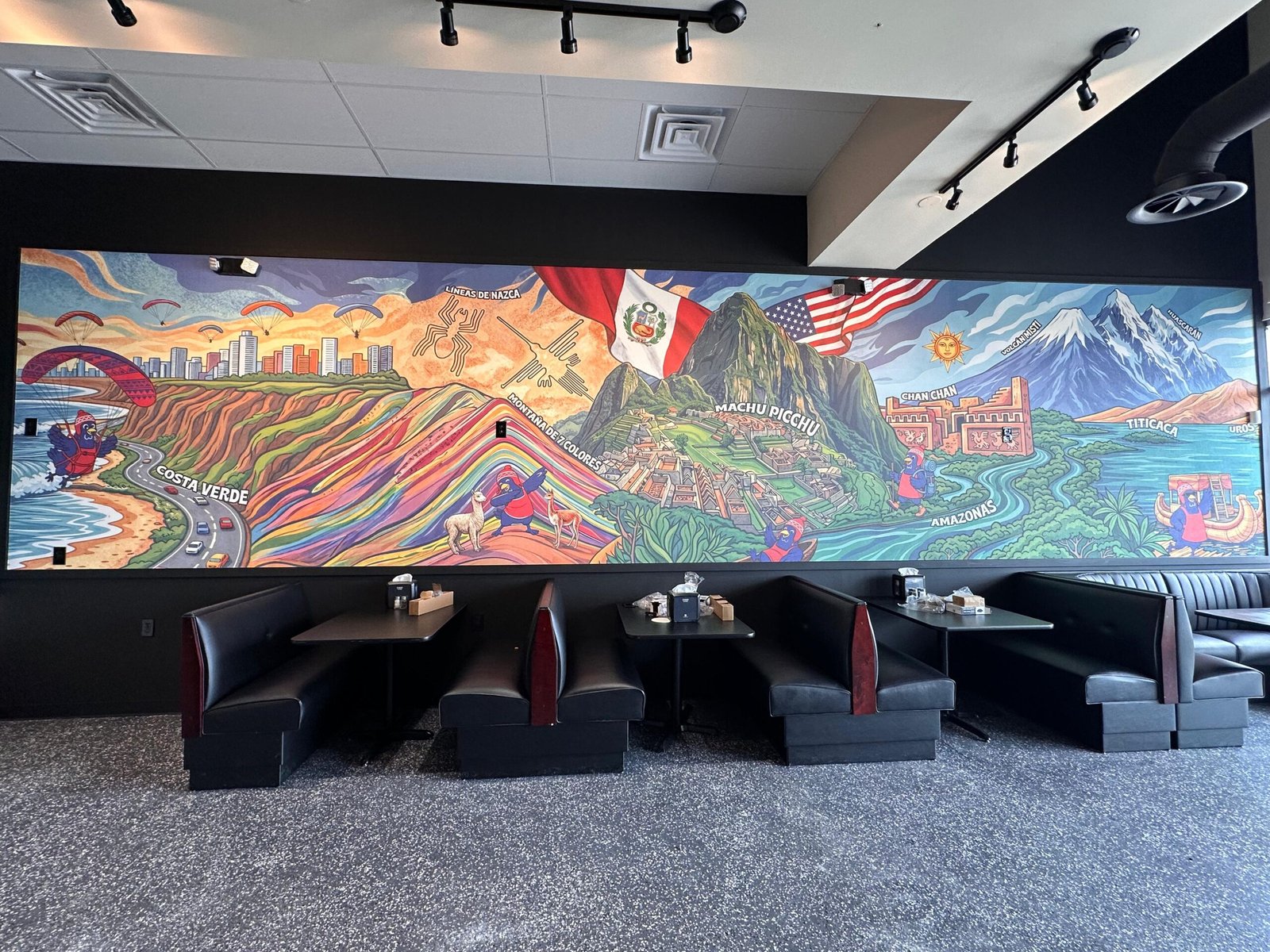 Peruvian-themed restaurant — full-wall custom wallpaper view from across the dining room