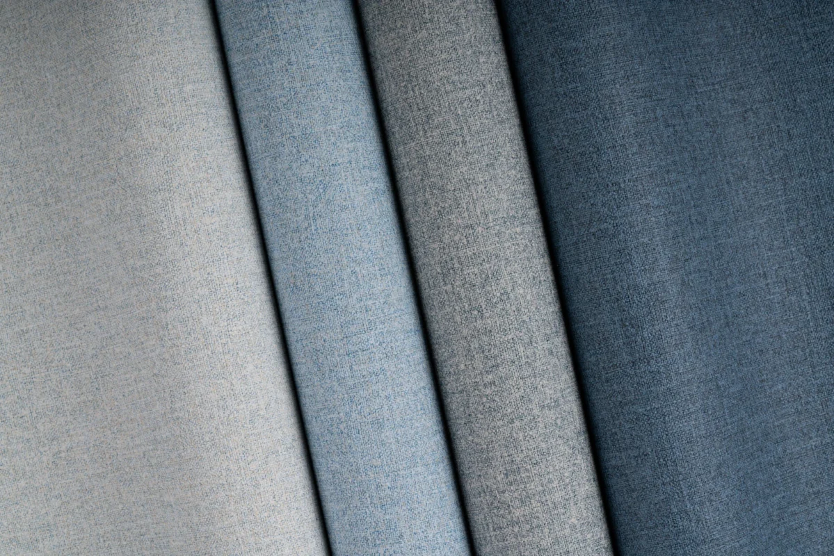 Linsey wallcovering, shown in Fleece, Sky, Angora, Abaca