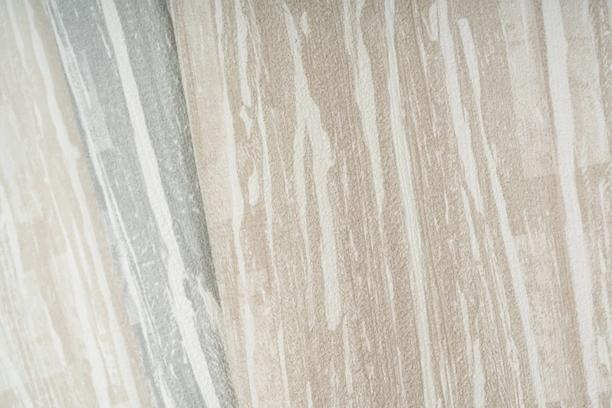 Streamline wallcovering, shown in Parchment, Arctic, Sand